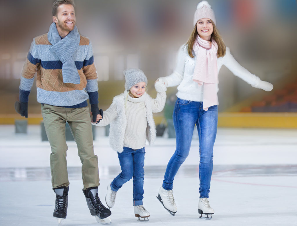 Parents and kid ice skating