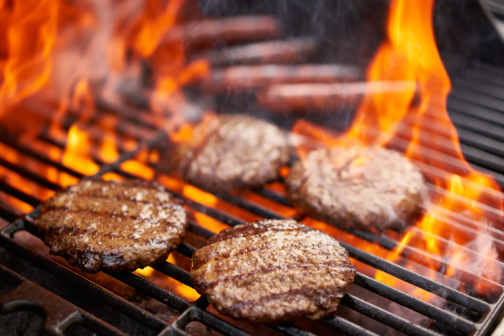 grilling hamburgers and hot dogs